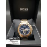 A brand new, gent?s, HUGO BOSS chronograph watch. Gold plated with dark blue dial. With original