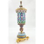 A RUSSIAN SILVER GILT ENAMELLED LIDDED VASE WITH LION FEET . 19.5gms 26cms