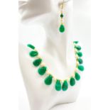 A beautiful necklace and earrings set of pear shaped emeralds and natural pearls. Necklace length: