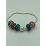 Silver Pandora style bracelet having silver/ glass and silver/enamel charms. 925 silver. Excellent