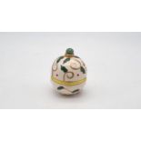 Christmas themed ceramic box in the style of a Faberge Egg. Jade accent top with gold metal clasp.