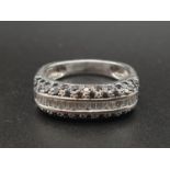 An 18K White Gold White and Black Diamond Ring. Size P. 1ct diamond, 6.3g