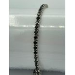 SILVER and BLACK SPINEL slider BRACELET having gemstones set and mounted in tennis bracelet style.