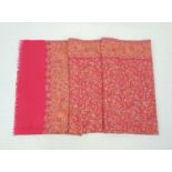 A very large red paisley wool scarf/shawl. 220cm x 110cm. Good condition.