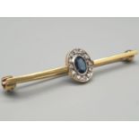 An 18K Yellow Gold Diamond and Sapphire Cluster Brooch. 0.2ct. 3.3g. 4cm