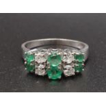 A 14K White Gold Diamond and Emerald Ten Stone Ring. 3g. Size P. 0.3ct diamond. 0.6ct emerald.