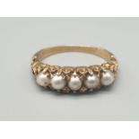 A 16K Yellow Gold 5 Seed Pearl Ring. Size R. 3.78g