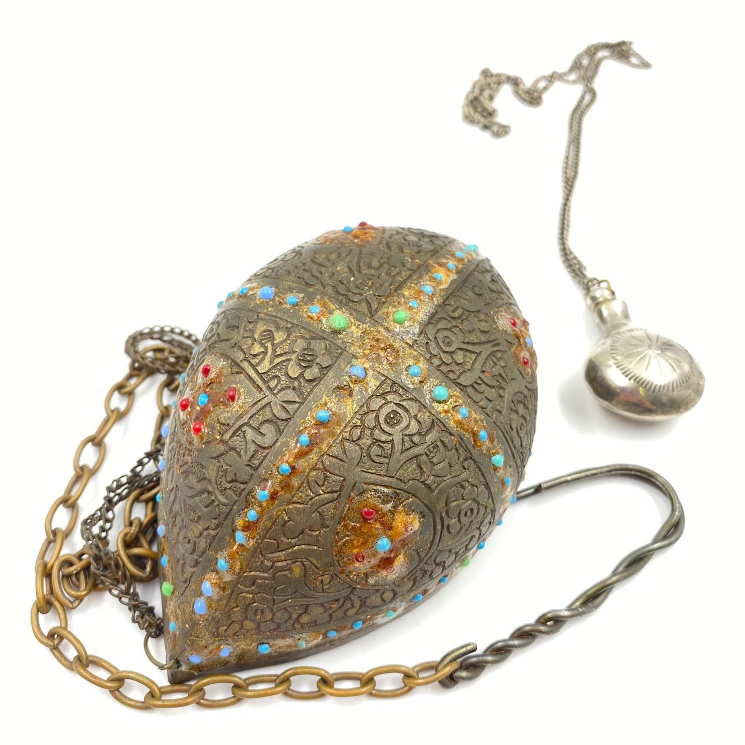 AN ANTIQUE KASHKUL MADE FROM BRASS AND DECORATED WITH TURQUOISE AND OTHER STONE. 13CM X 7.5CM AND