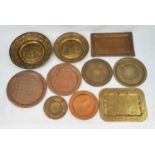 A SELECTION OF 10 INDIAN/PERSIAN VINTAGE BRASS AND COPPER SERVING TRAYS. ASSORTED SIZES.