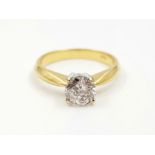 AN 18K YELLOW GOLD RING SET WITH A ROUND BRILLIANT CUT DIAMOND OF .87CT, 3.9gms size N