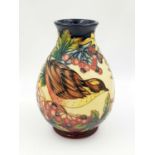 A 2002 Moorcroft Vase. Beautiful bird and floral decoration. 20cm tall. Very good condition but a/f.