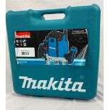 A Makita RP1800 1/2 Inch Plunge Router. As new, unused, in original box.