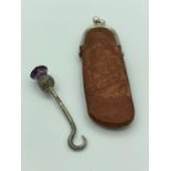 ANTIQUE SILVER MINIATURE BUTTON HOOK having amethyst coloured stone finial and complete with