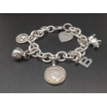 A Tiffany and Co Sterling Silver Bracelet with 5 Various Charms - including Links of London and