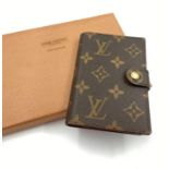 An Louis Vuitton Monogramed Work Pad Cover Case. Good condition. Comes with gilded touch-pen. Also