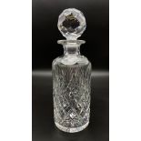A VINTAGE QUALITY CUT GLASS DECANTER WITH HEAVY GOOD FITTING STOPPER. 26cms IN HEIGHT