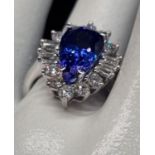 Beautiful tanzanite and diamond set ring in 18k white gold, size O1/2 weight 6.7g Centre pear shaped