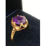 9 carat GOLD RING having large faceted oval AMETHYST set to top in crown mount.Having attractive