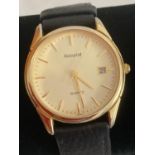 Gentlemans ACCURIST quartz wristwatch in Goldtone having date window and sweeping second hand.