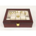 A ROLEX watch display box with shatter-proof glass. It accommodates 10 watches. With velvet interior