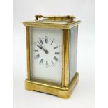 An Antique Brass Carriage Clock. In working order. 11cm tall