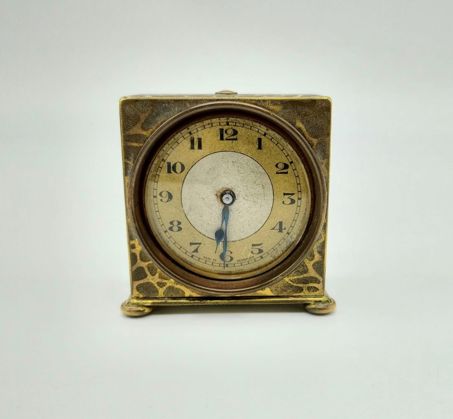 An Early French Travel Alarm Clock - Patented. In a rockery pattern. 5 x 5cm. In working order.