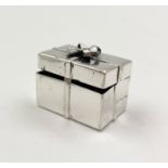 A Sterling Silver Trinket Box. Gift parcel shape. 13g 25 x 16mm.