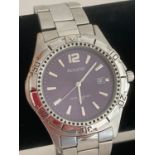 Gentlemans ACCURIST Quartz wristwatch in stainless steel. Water resistant Purple face model having