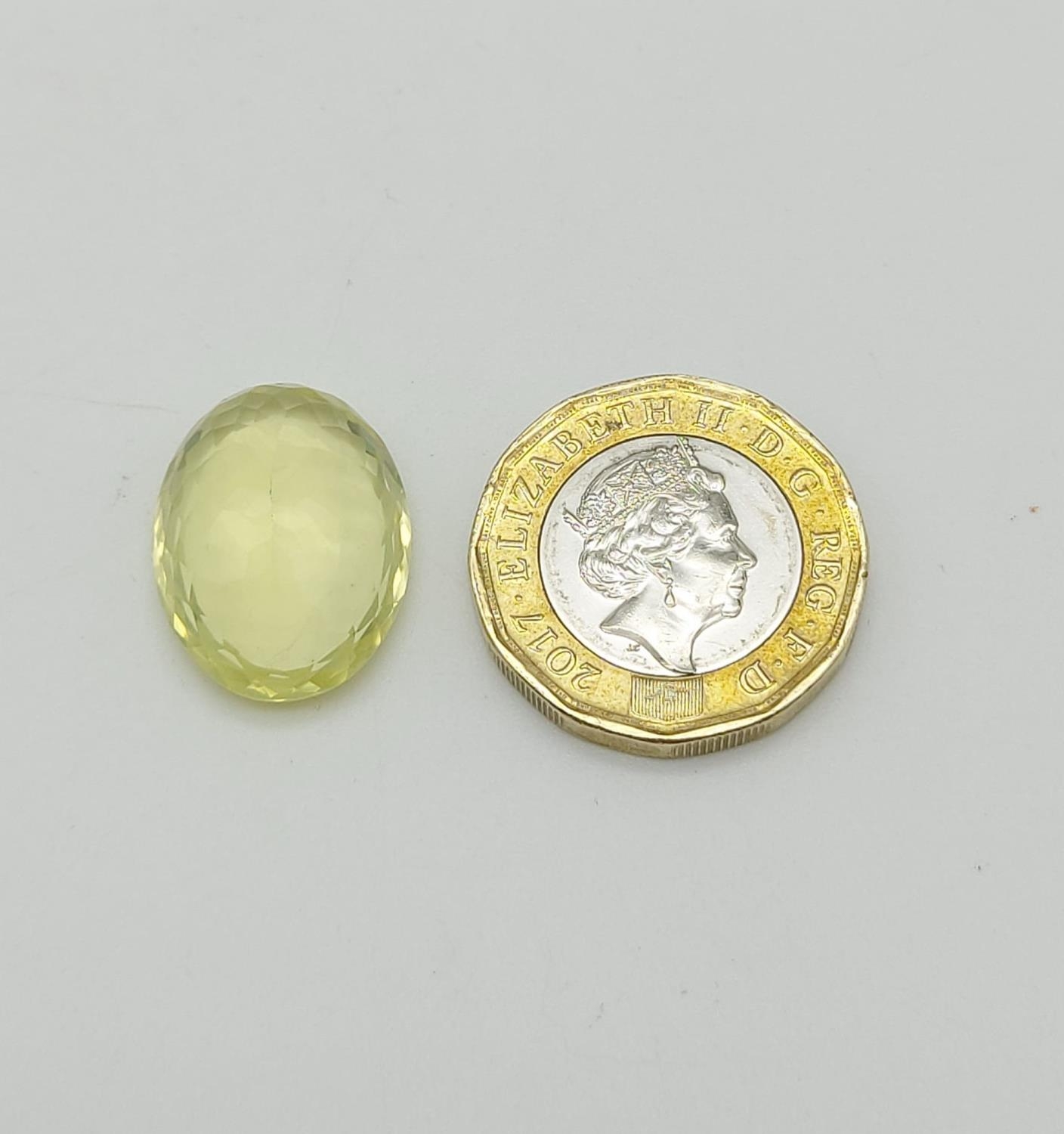 15.08CTS NATURAL LEMON QUARTZ, OVAL MIXED CUT. COMES WITH IDT CERTIFICATION - Image 2 of 3