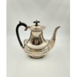 An Antique Silver Daniel and John Wellby Tea Pot. Hallmarks for London 1904. 21cm tall. Note! The