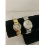 Two ladies Quartz wristwatches ,gold tone and silver tone,gold tone having attractive stone set