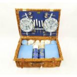 A 1960'S VINTAGE BREXTON PICNIC HAMPER UNUSED CONTAINING THE ORIGINAL CHINA CROCKERY. 52 X 36cms