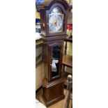 A Granddaughter upright CLOCK by Thomas Byrne with pendulum and chimes. Nice ornate face with