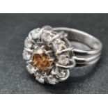 An 18K White Gold Pre-1940 Edwardian Diamond Cluster Ring. 0.5ct Centre-Set with a 1.25ct GIA