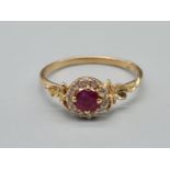 An Alex Monroe 18K Yellow Gold Spring Halo Diamond and Ruby Ring. Size P. 2.27g.