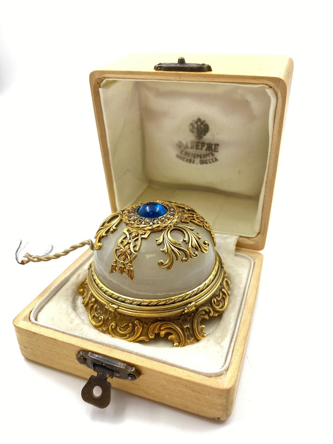 An Antique Russian Silver Gilt and Diamond Table Bell. White Onyx with a centre Sri Lankan Sapphire.