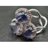 An 18K White Gold Diamond and Amethyst Ring. 0.54ct 9.4ct - amethyst. 9.4g total weight. Size P.