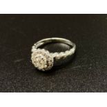 An impressive diamond 18k white gold ring, set with 0.62ct diamonds in total. Size M weight 3.83g