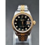 A LADIES TWO TONE GOLD AND STEEL ROLEX OYSTER PERPETUAL DATEJUST WITH BLACK FACE AND DIAMOND