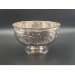 AN ANTIQUE CHINESE EXPORT 19TH CENTURY SOLID SILVER FOOTED BOWL WITHHANDSOME RELIEF WORK IN A FLORAL