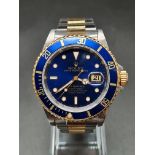 A ROLEX SUB MARINER IN BI-METAL WITH BLUE FACE AND MATCHING BEZEL. 40mm WITH ORIGINAL GUARANTEE