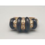 An Art Deco, 18 K (fully hallmarked) yellow gold ring with black onyx and diamonds. Ring size: K,