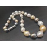 A necklace with multicoloured, graduating sized pearls (10-19 mm) and 18 K white gold clasp and