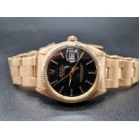 AN 18K GOLD GENTS ROLEX OYSTER PERPETUAL DATE WITH FABULOUS CONTRASTING BLACK FACE. 36MM