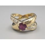 An 18 K (fully hallmarked) yellow gold ring, designed by JOSE HESS with a ruby and diamond