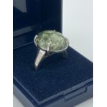 SILVER and SERAPHINITE RING Having large polished oval Séraphinite mounted to top.Beautiful creamy