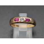 An 18k Yellow Gold Diamond & Ruby 5 Stone Ring. Size P. 4.4g 0.15ct