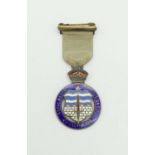 A Solid Silver Gilt and Enamel Royal Masonic Institution 1929 Boys Medal. Comes in original box.