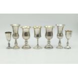 Seven Antique Silver Kiddush Cups of Varying Sizes. (one pair). Tallest cup - 12cm. 335g total