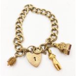 A Vintage 9K Yellow Gold Twisted-Curb-Link Bracelet with Heart Clasp and Three Unusual Charms.
